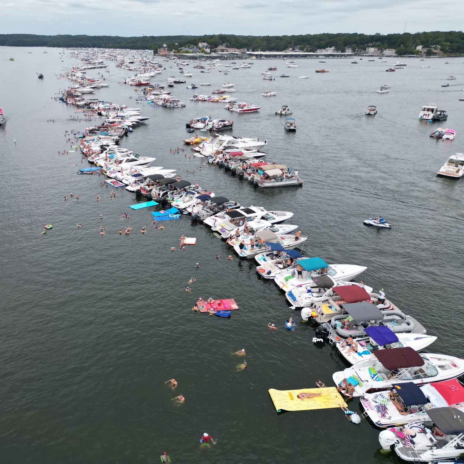 Aerial view of boats gathered in a Lake of the Ozarks cove near Osage Beach during summer boating season